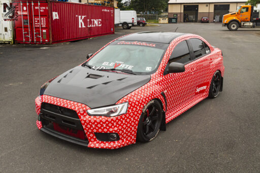 Mitsubishi Evolution X wrapped in a custom LV x Supreme print on Avery 1105 EZ RS